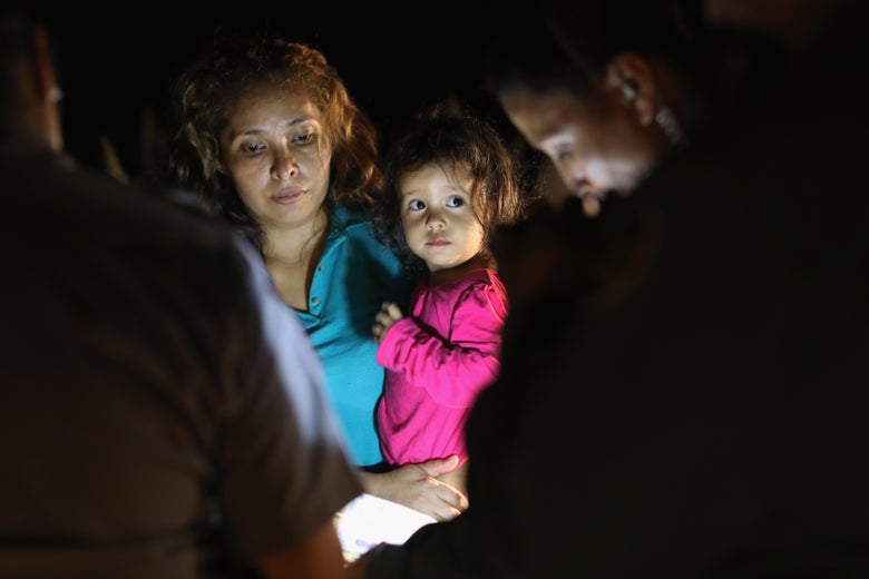 Central American asylum seekers, including a Honduran girl, 2, and her mother, are taken into custody near the U.S.-Mexico border on June 12, 2018 in McAllen, Texas.
